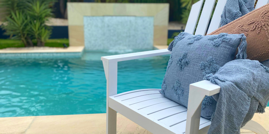 Rustic Blue Cushion And Throw on White Coastal Chair Poolside | Home Decor Store